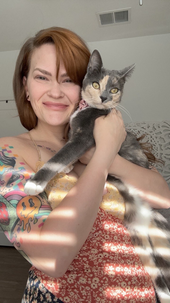 Samantha holding Lily in the sunlight